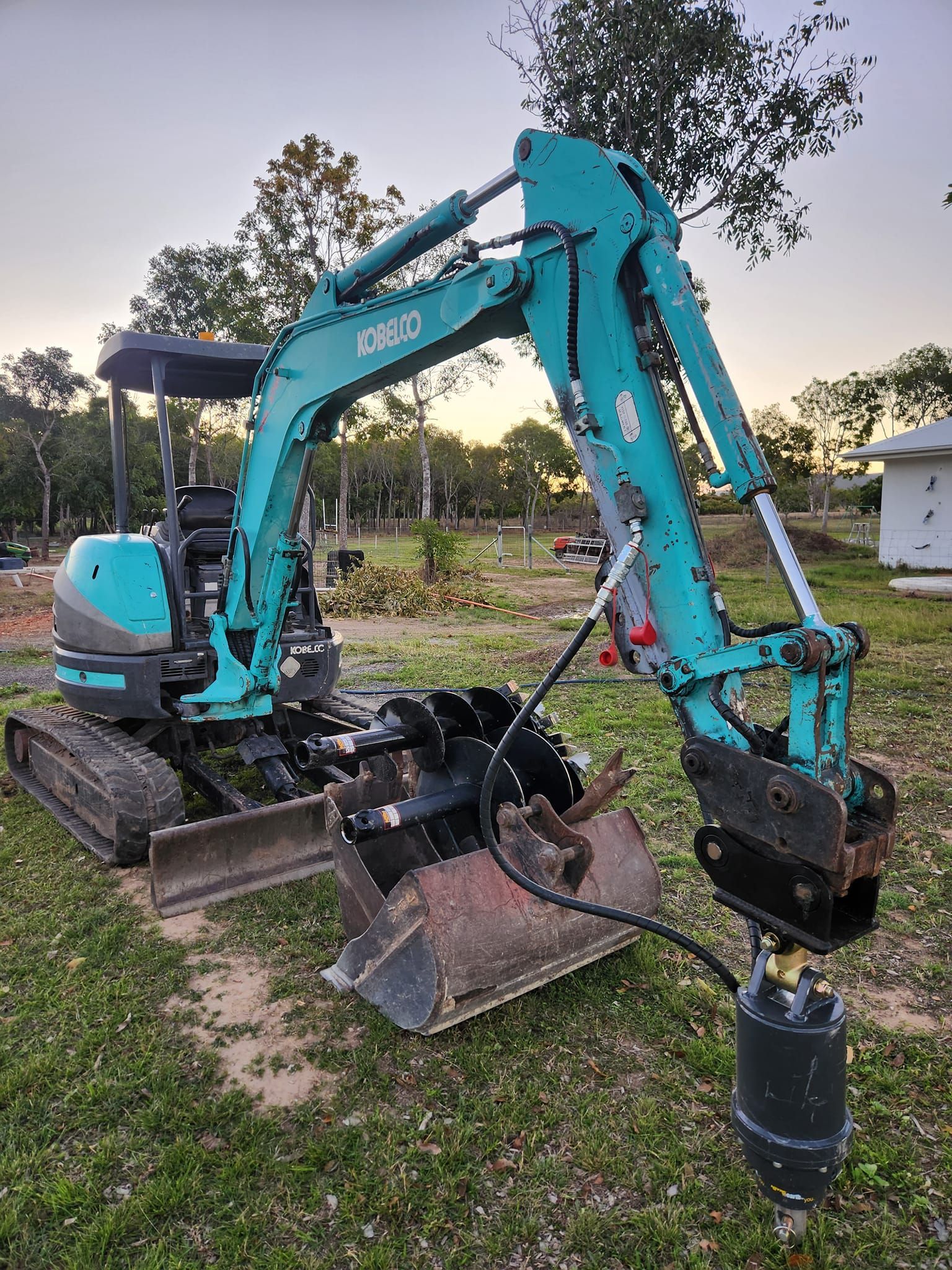 A Teal Kobelco Mini Excavator — AGM HIRE NQ in Condon, QLD