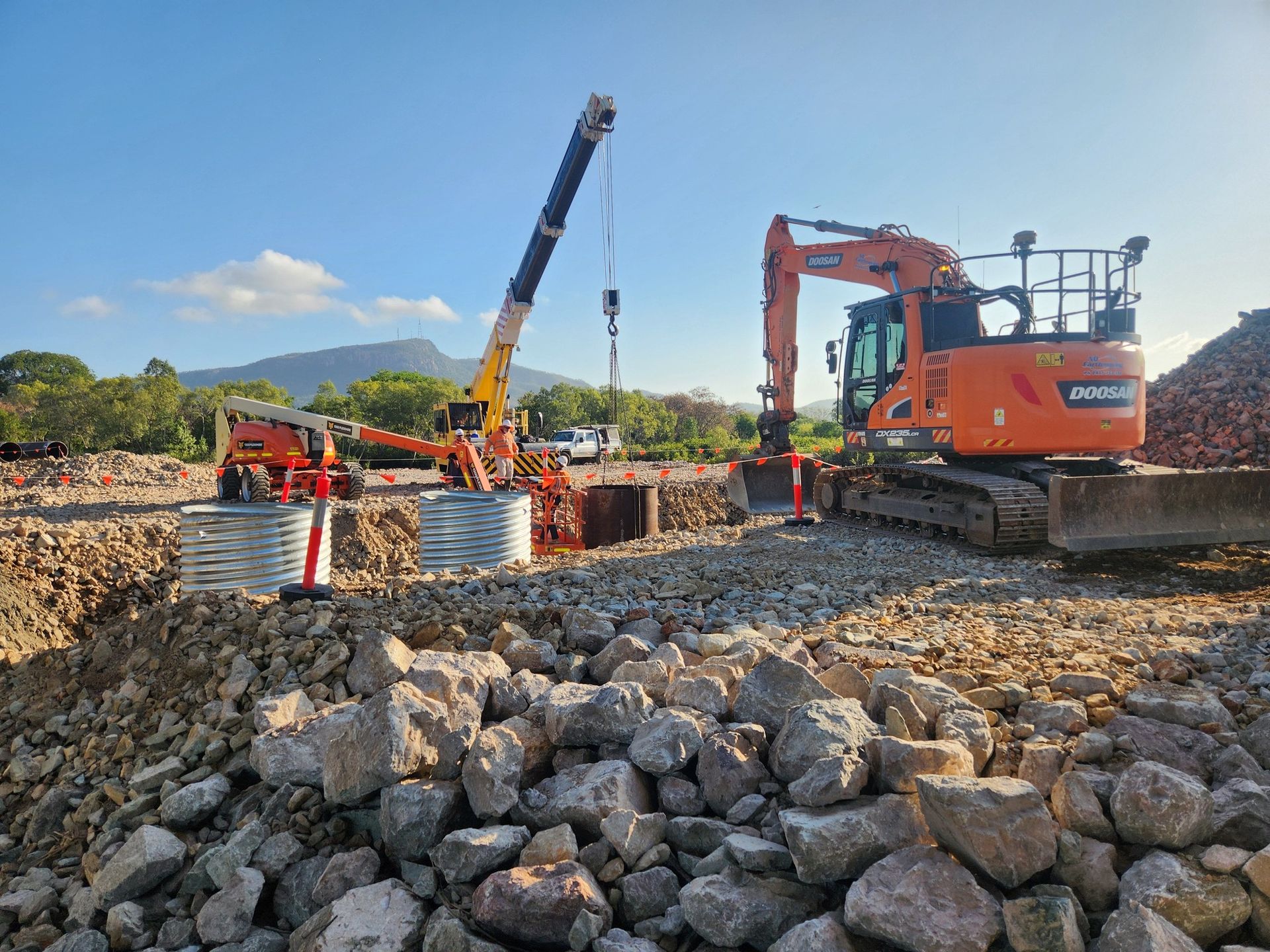 Construction Site With Excavator and Crane — AGM HIRE NQ in Condon, QLD