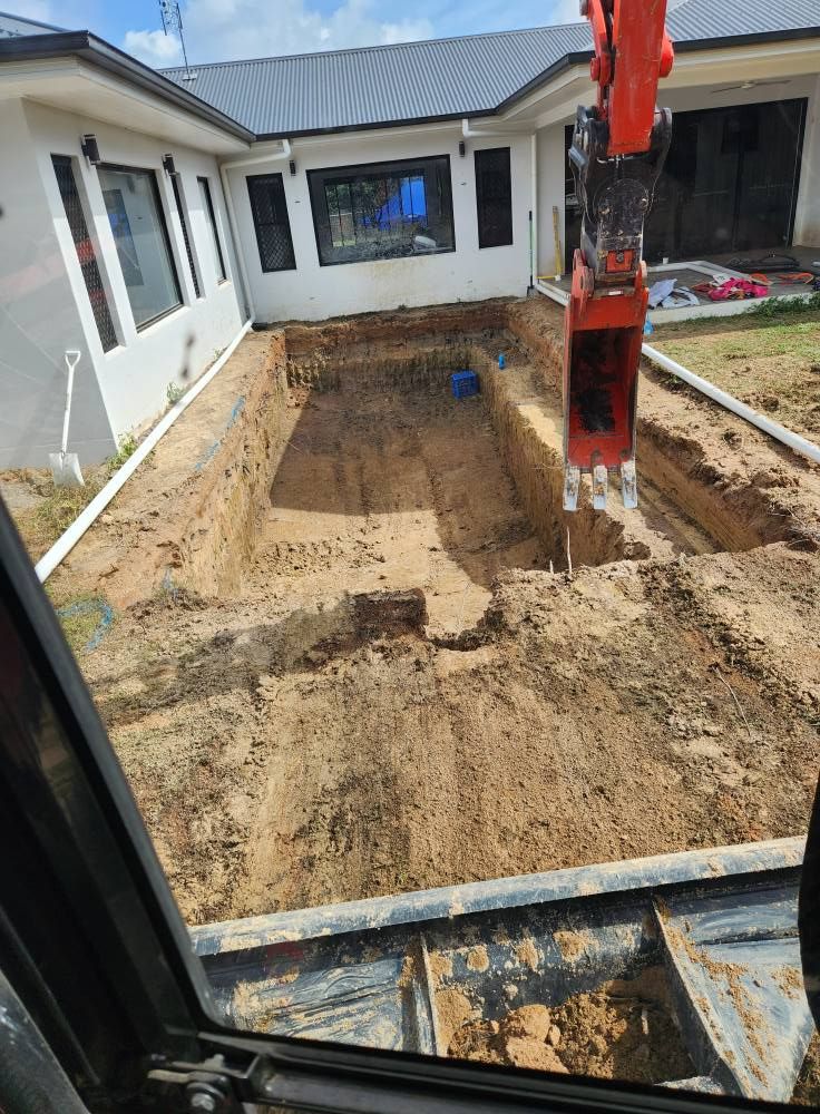Excavator Digging a Rectangular Hole in a Backyard — AGM HIRE NQ in Kirwan, QLD