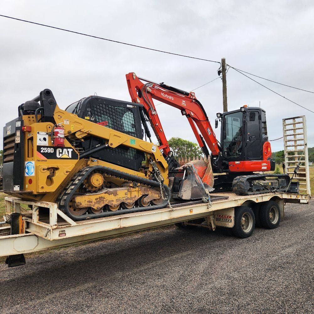 Yellow Caterpillar Skid Steer and Red Kubota Excavator — AGM HIRE NQ in Condon, QLD