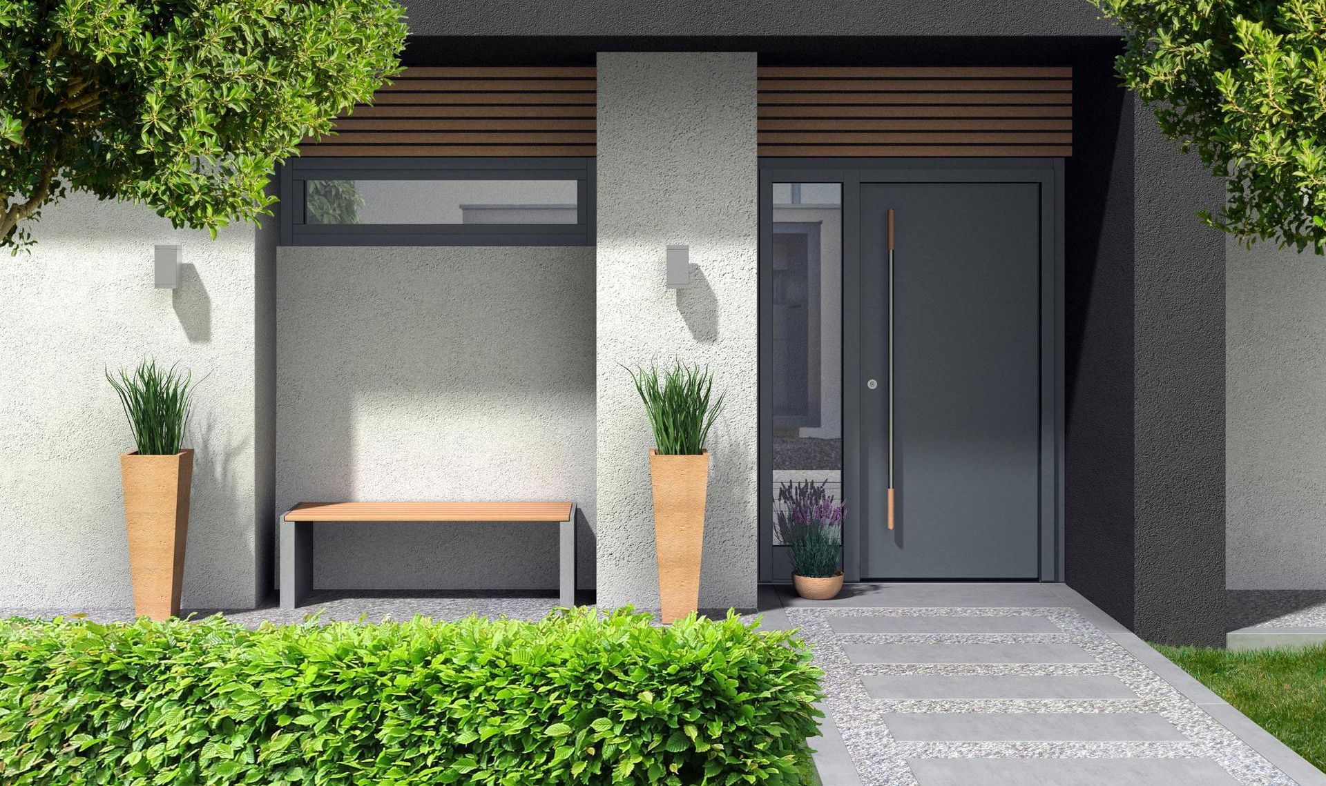 Una casa moderna con una porta grigia e una panchina davanti.