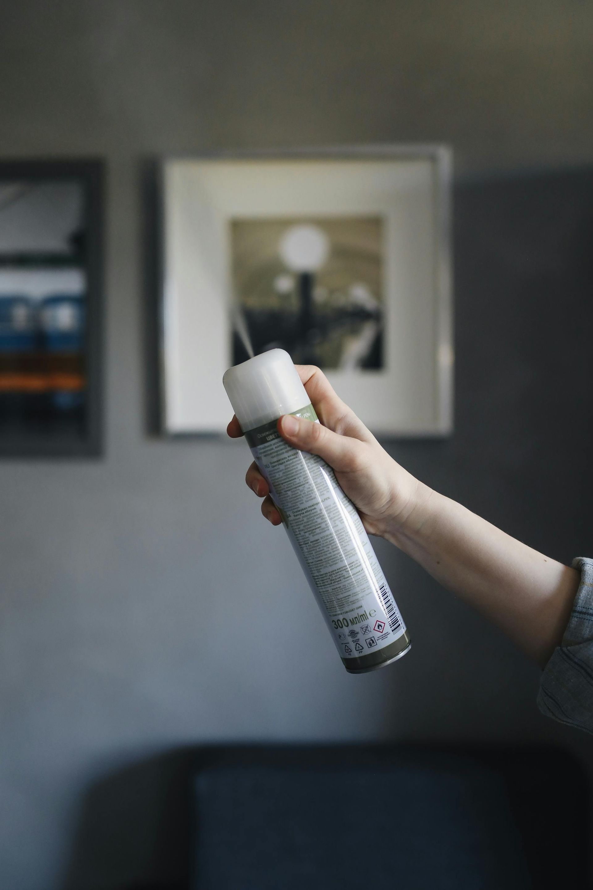 New Jersey homeowner using DIY pest spray indoors, unaware of hidden health and safety risks