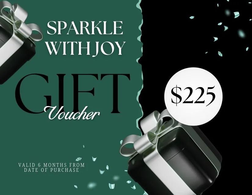 Gift voucher with emerald green and black background, black gift boxes with silver bows, and $225 value.