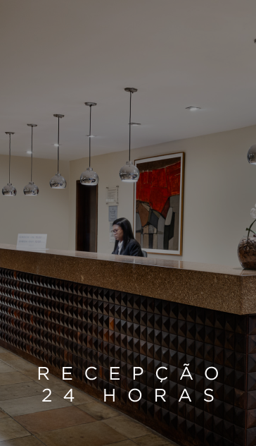Hotel reception desk with attendant; 