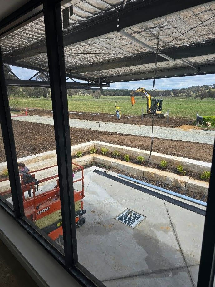 View Through a Window of Construction Site — One Group Industries Pty Ltd in Bathurst, NSW