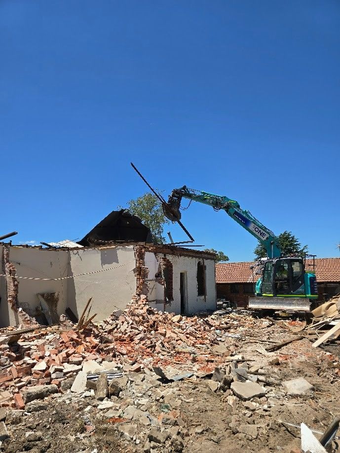 A Excavator Demolishes a Brick Building — One Group Industries Pty Ltd in Bathurst, NSW