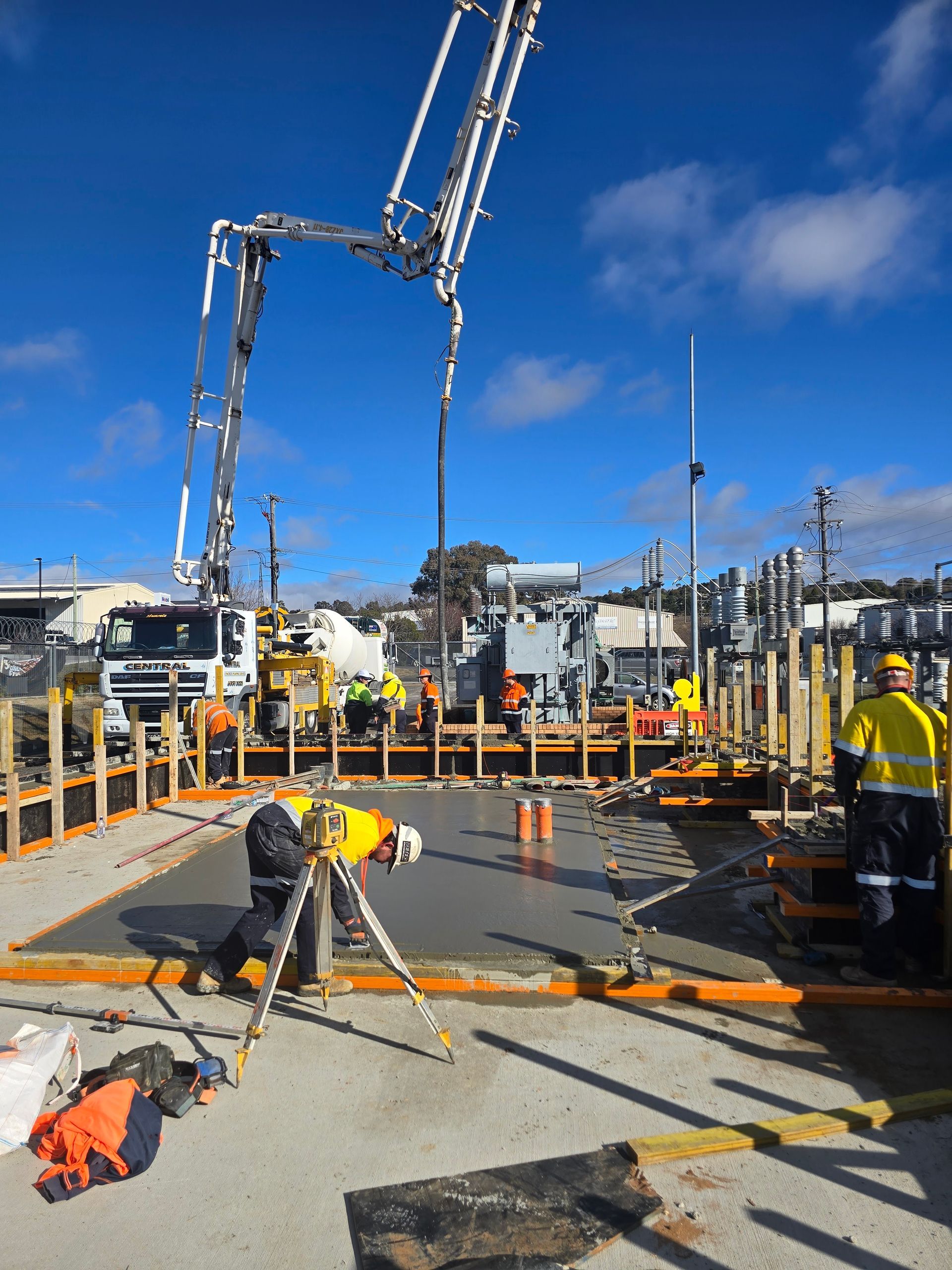 Construction site with concrete being poured — One Group Industries Pty Ltd in Bathurst, NSW