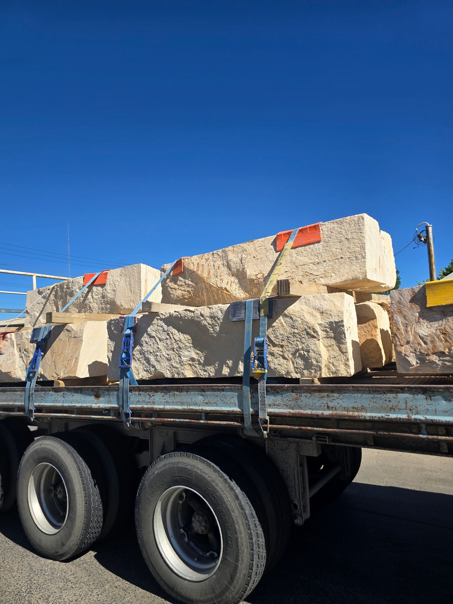 A White Crane Truck Parked on A Grassy Lot — One Group Industries Pty Ltd in Bathurst, NSW