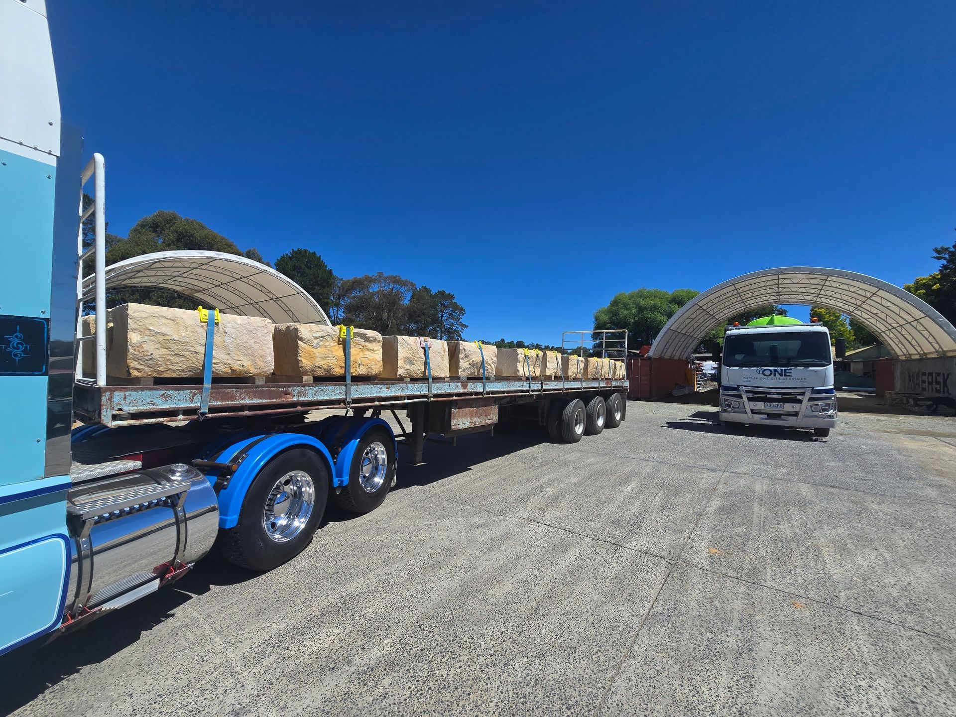 A Yellow Excavator Arm with A Mechanical Lifting Clamp  — One Group Industries Pty Ltd in Bathurst, NSW