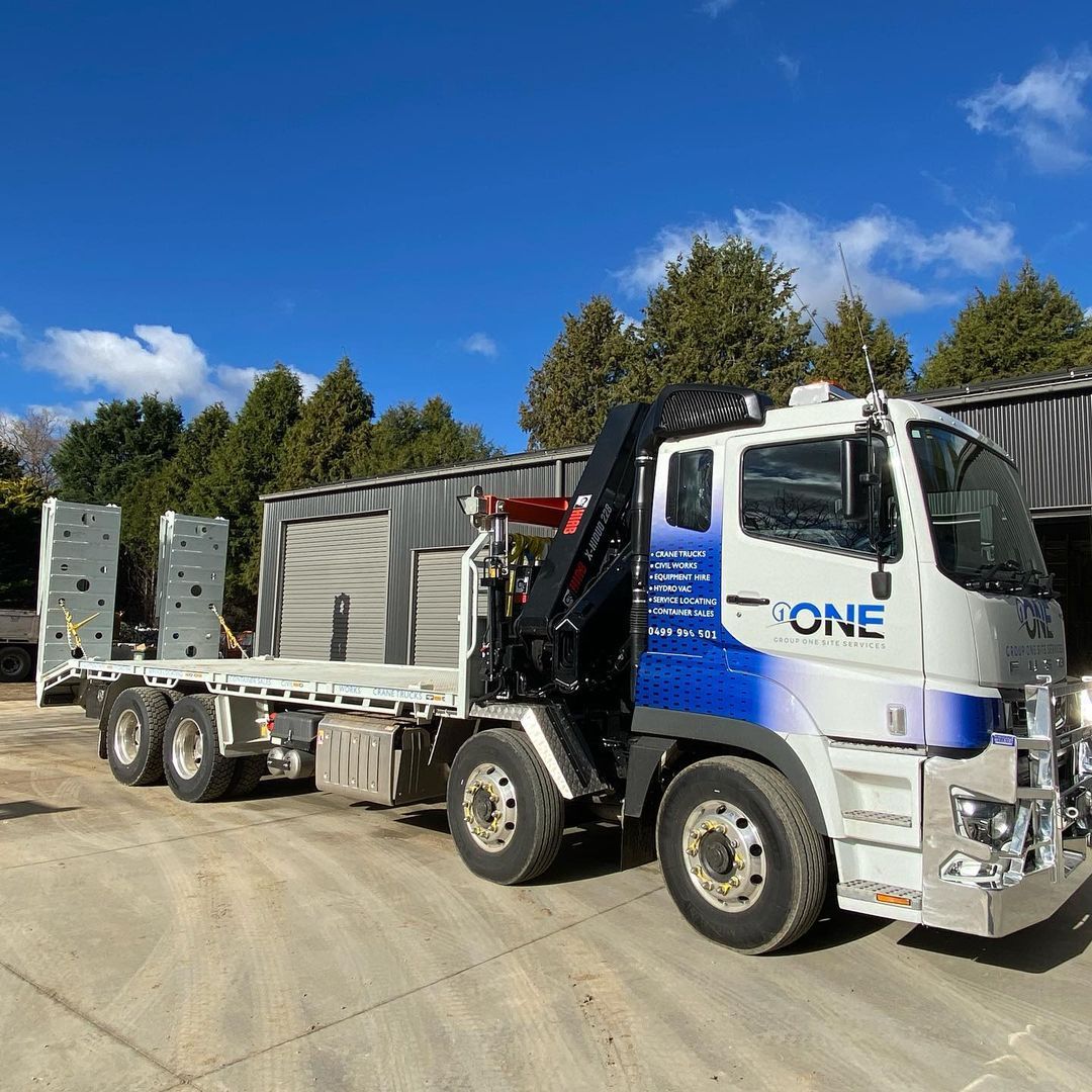 A White and Blue Truck With the Word One on the Side — One Group Industries Pty Ltd in Bathurst, NSW