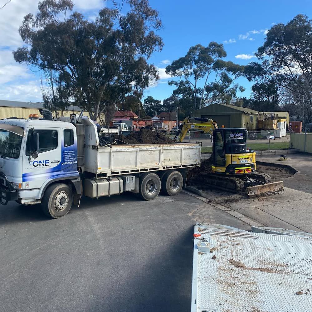 A Dump Truck With the Word One on the Side — One Group Industries Pty Ltd in Bathurst, NSW