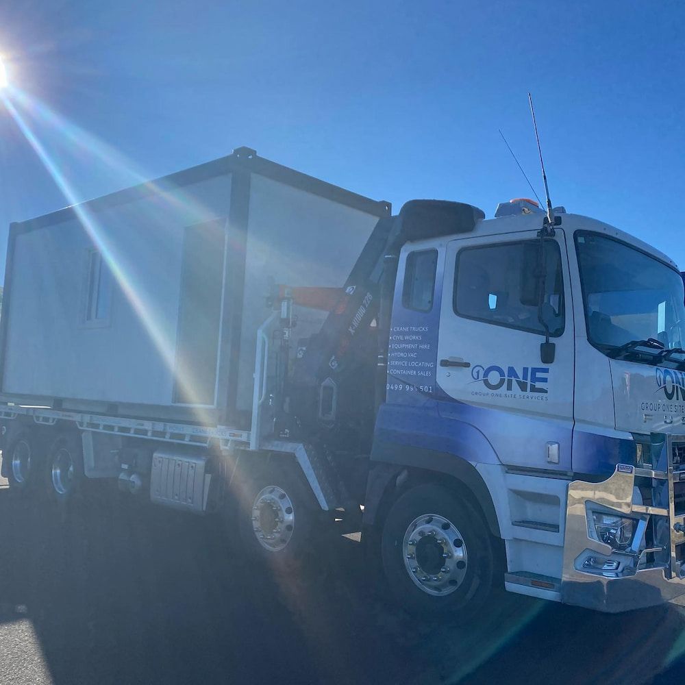 A White and Blue Truck With the Word One on the Side — One Group Industries Pty Ltd in Bathurst, NSW