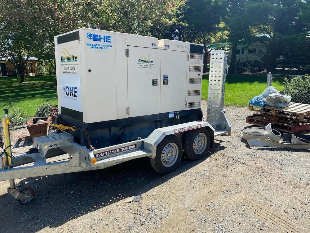 A Trailer With a Generator on It is Parked on a Dirt Road — One Group Industries Pty Ltd in Bathurst, NSW