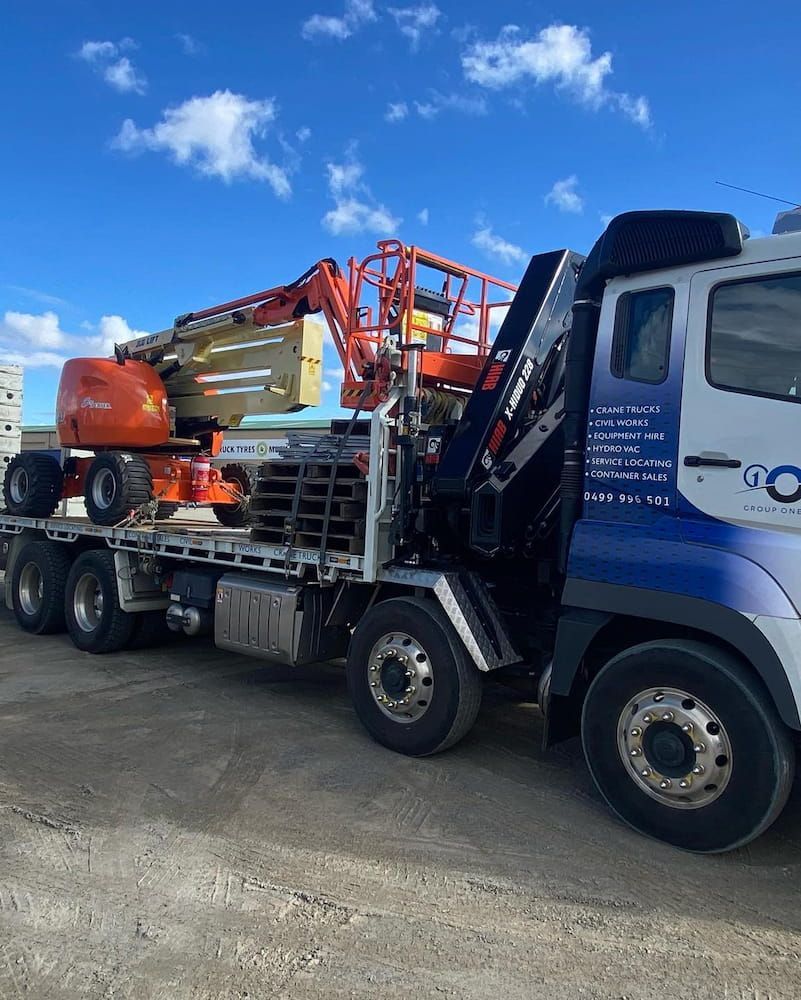 A Truck With a Crane on the Back of It — One Group Industries Pty Ltd in Bathurst, NSW