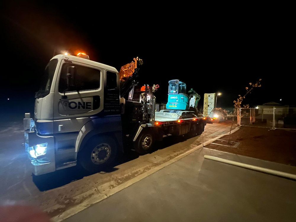 A Large Truck is Parked on the Side of the Road at Night — One Group Industries Pty Ltd in Bathurst, NSW