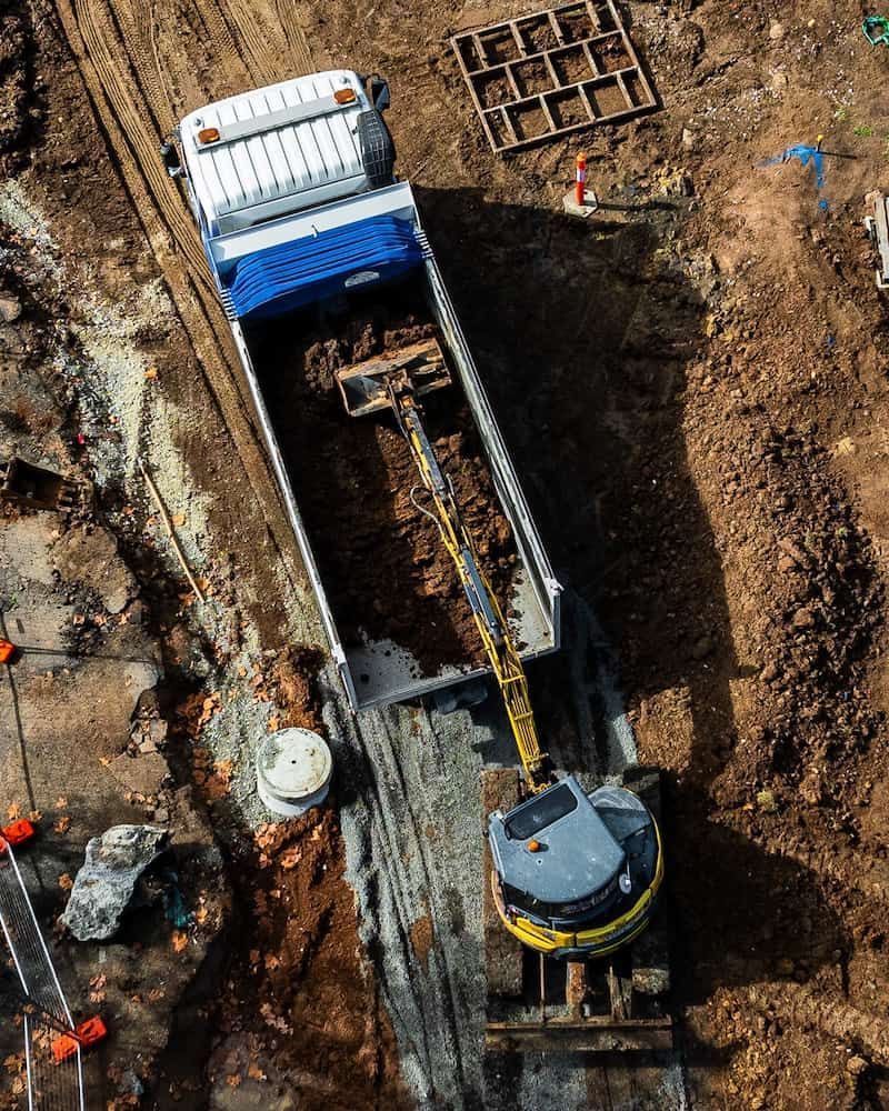 An Aerial View of a Construction Site With a Truck and Excavator — One Group Industries Pty Ltd in Bathurst, NSW