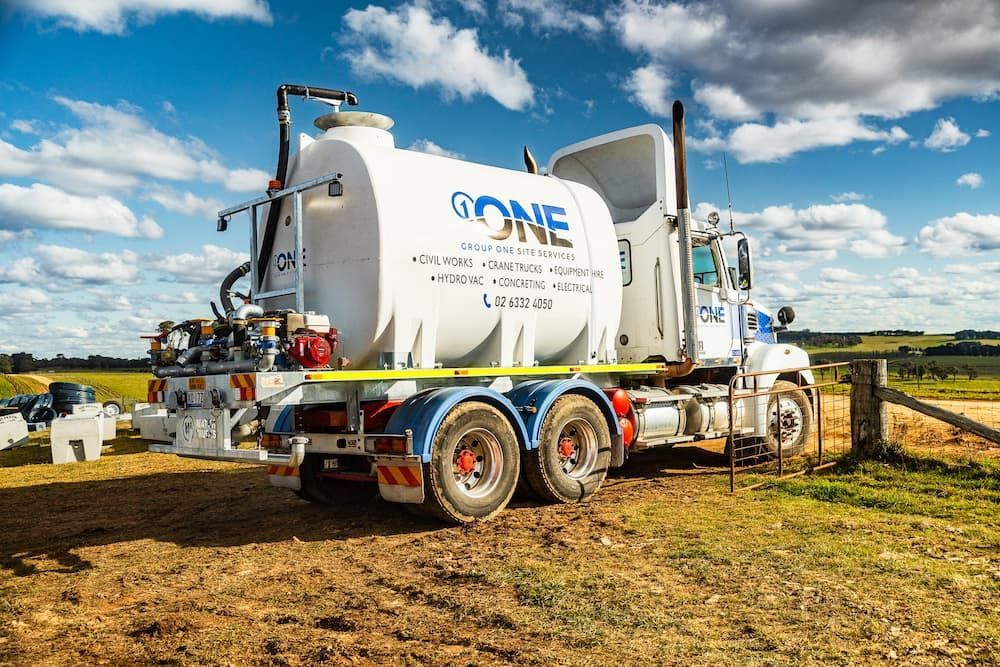 A Large White Truck is Parked in a Field — One Group Industries Pty Ltd in Bathurst, NSW