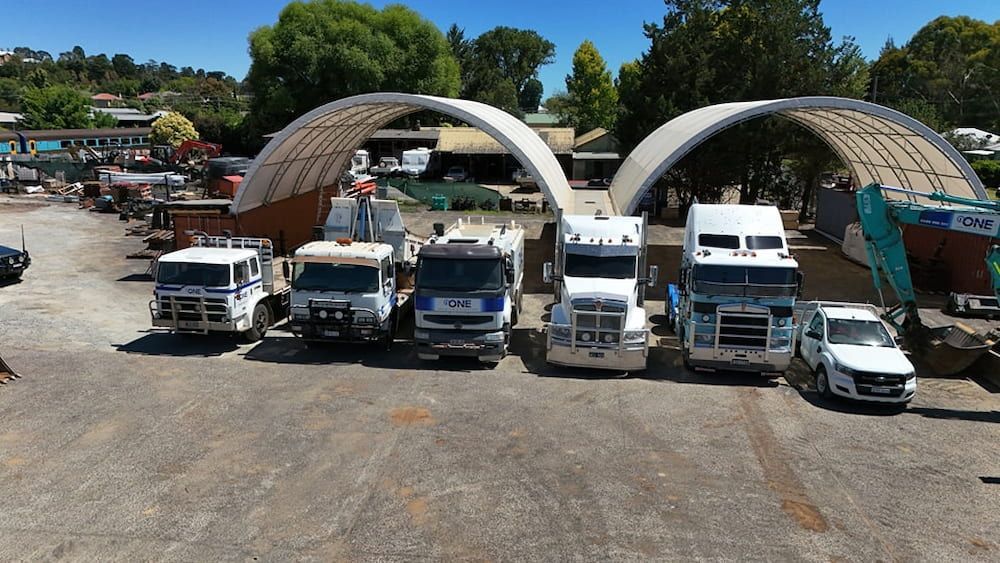 A Bunch of Trucks Are Parked in a Parking Lot — One Group Industries Pty Ltd in Bathurst, NSW