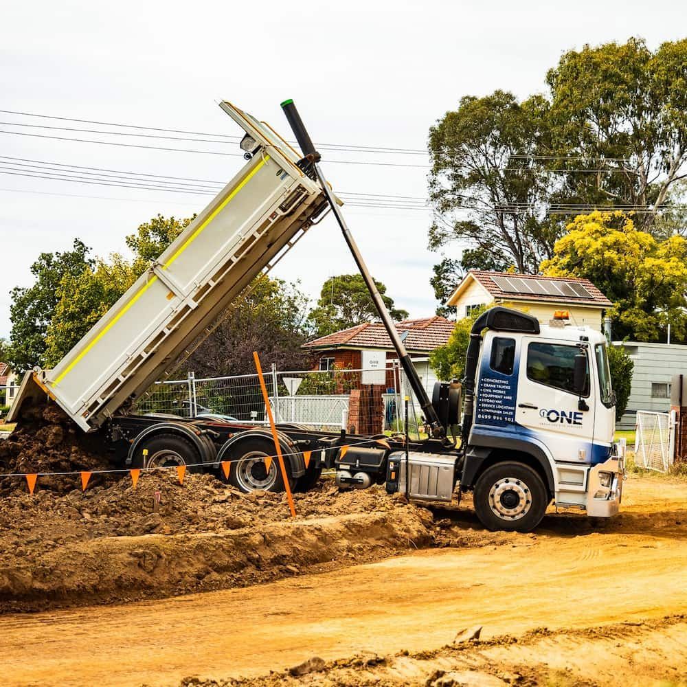 A Dump Truck With the Word One on the Side of It — One Group Industries Pty Ltd in Bathurst, NSW