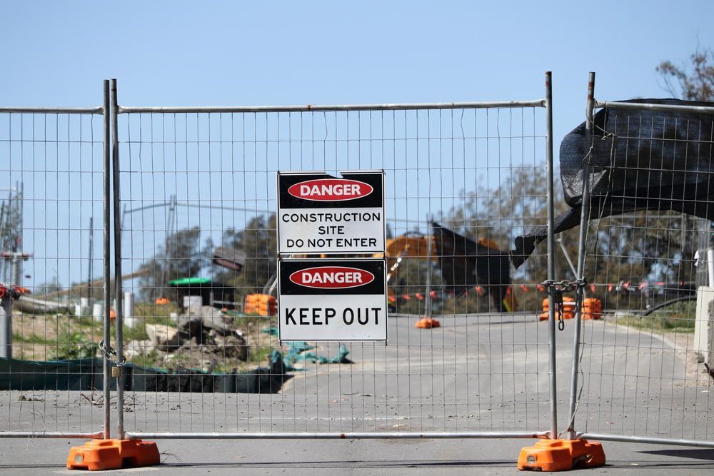 A Fence With a Danger Sign and a Keep Out Sign on It — One Group Industries Pty Ltd in Bathurst, NSW