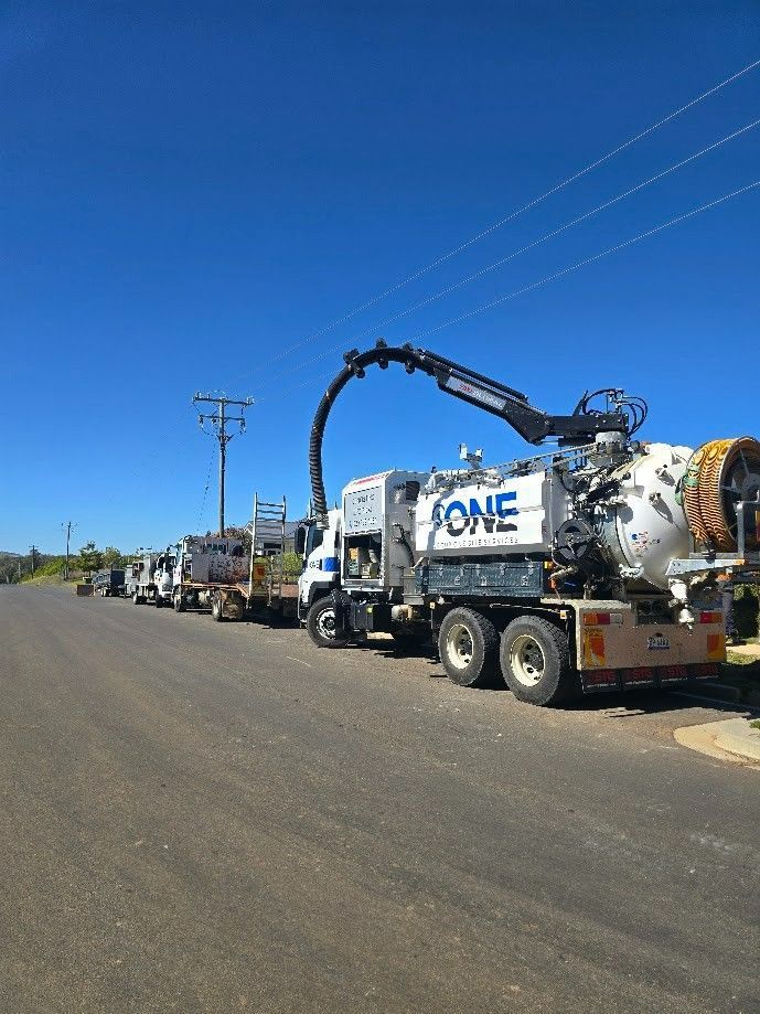 A Line of White Vacuum Trucks Are Parked — One Group Industries Pty Ltd in Bathurst, NSW