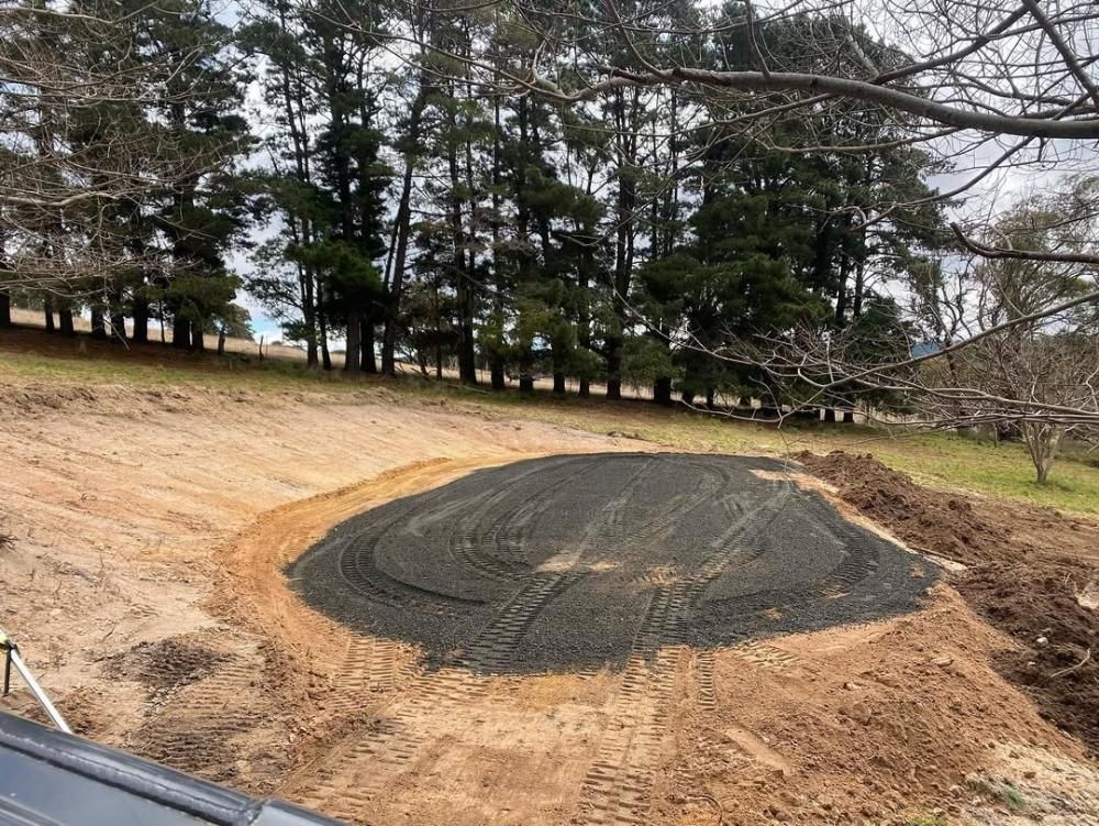A Large Pile of Dirt is Sitting in the Middle of a Dirt Field — One Group Industries Pty Ltd in Bathurst, NSW