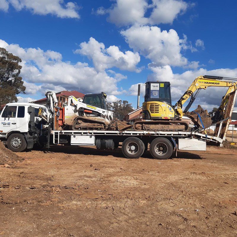 Two Trucks At The Back Of The White Truck — One Group Industries Pty Ltd in Bathurst, NSW