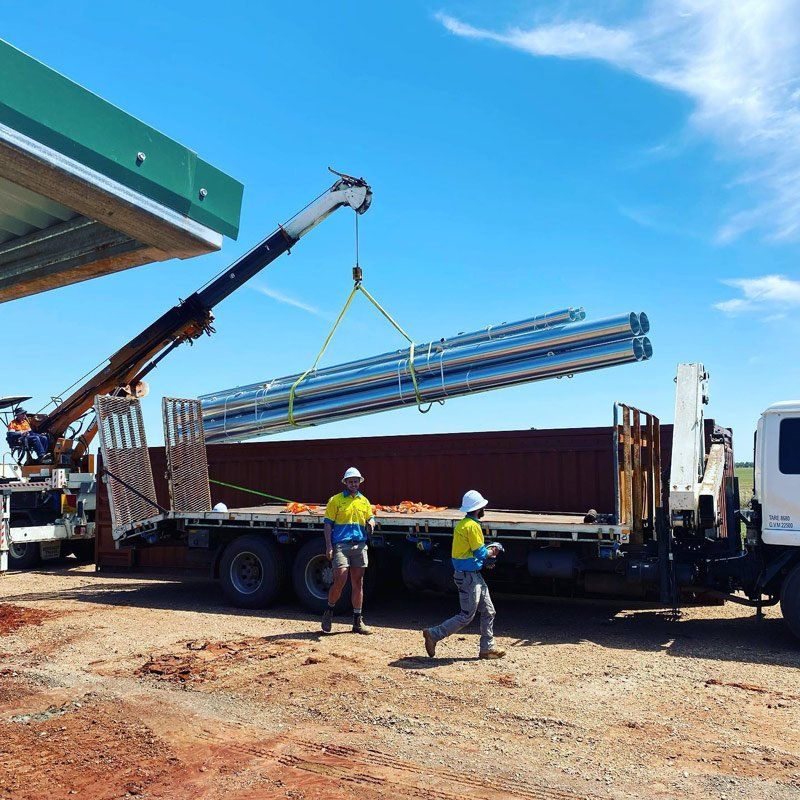 Crane Truck Lift The Metal Poles — One Group Industries Pty Ltd in Bathurst, NSW