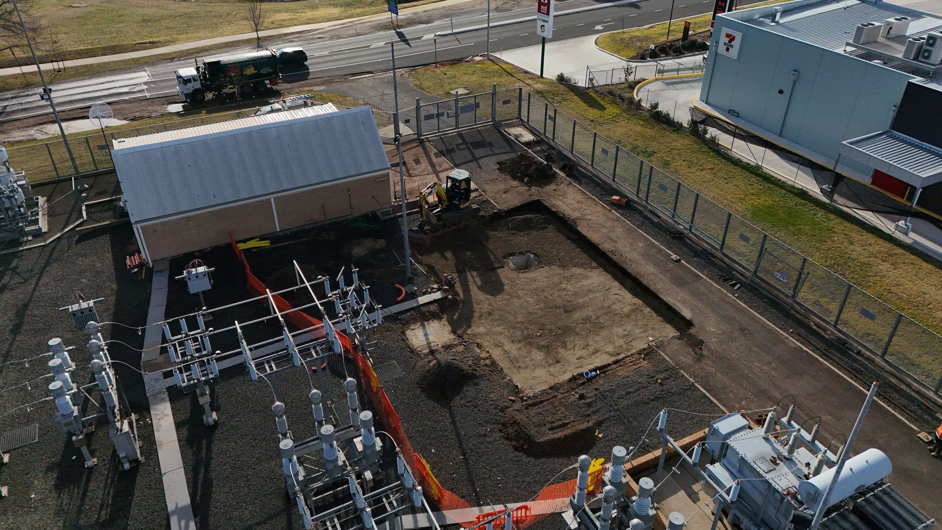 Aerial view of an electrical substation under construction, with a fenced perimeter — One Group Industries Pty Ltd in Bathurst, NSW
