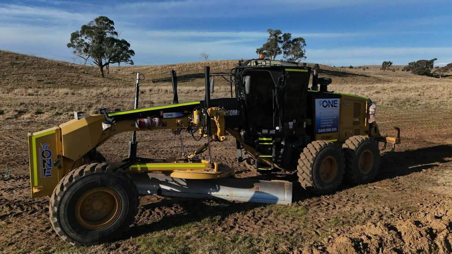 A Motor Grader on A Dirt Track — One Group Industries Pty Ltd in Bathurst, NSW