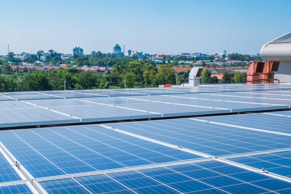 There Are Many Solar Panels on the Roof of a Building — One Group Industries Pty Ltd in Bathurst, NSW