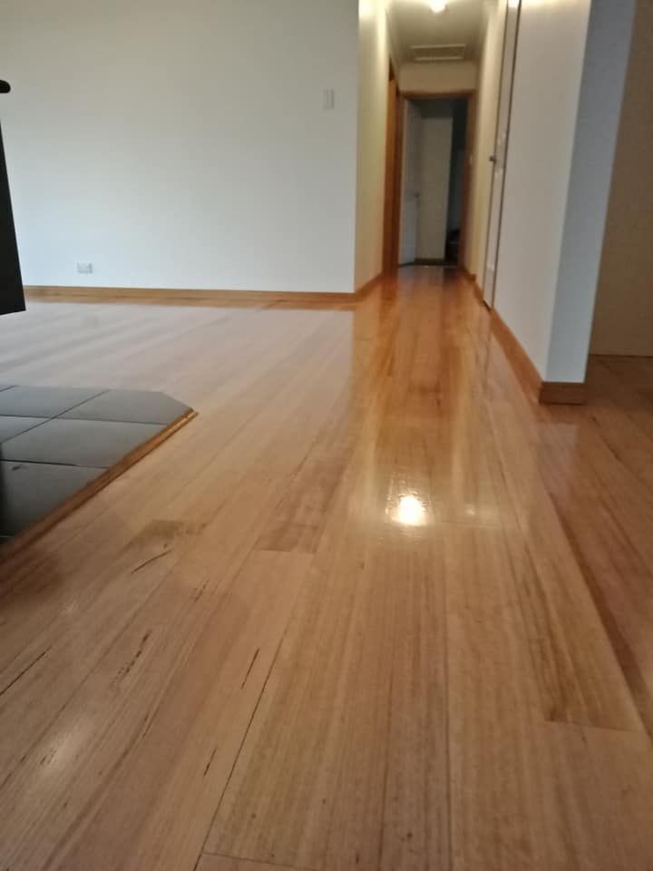 A Polished Hardwood Floor in a Brightly Lit Hallway — Finer Floors In Sorell, TAS