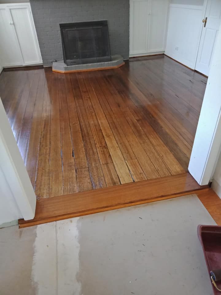 Freshly Polished Wood Floors Leading to a Fireplace — Finer Floors In Kingston, TAS