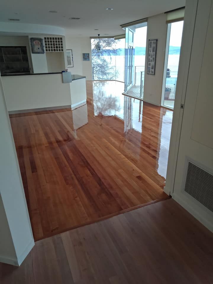 A High-gloss Wooden Floor in an Open-plan Living Room — Finer Floors In Cambridge, TAS