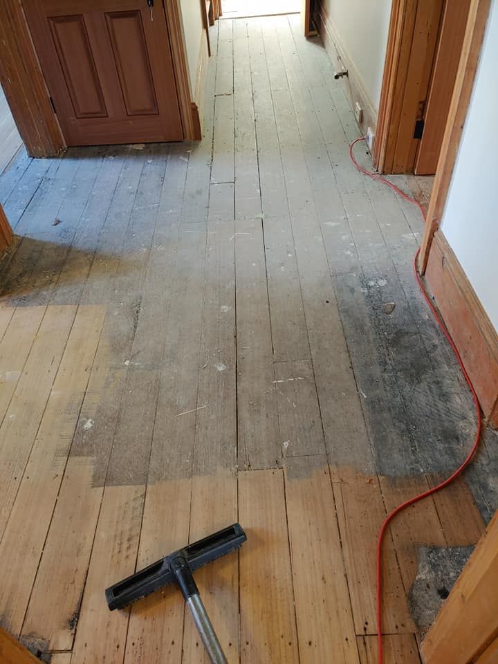 A Hallway With Wooden Floorboards Halfway Sanded — Finer Floors In Sorell, TAS