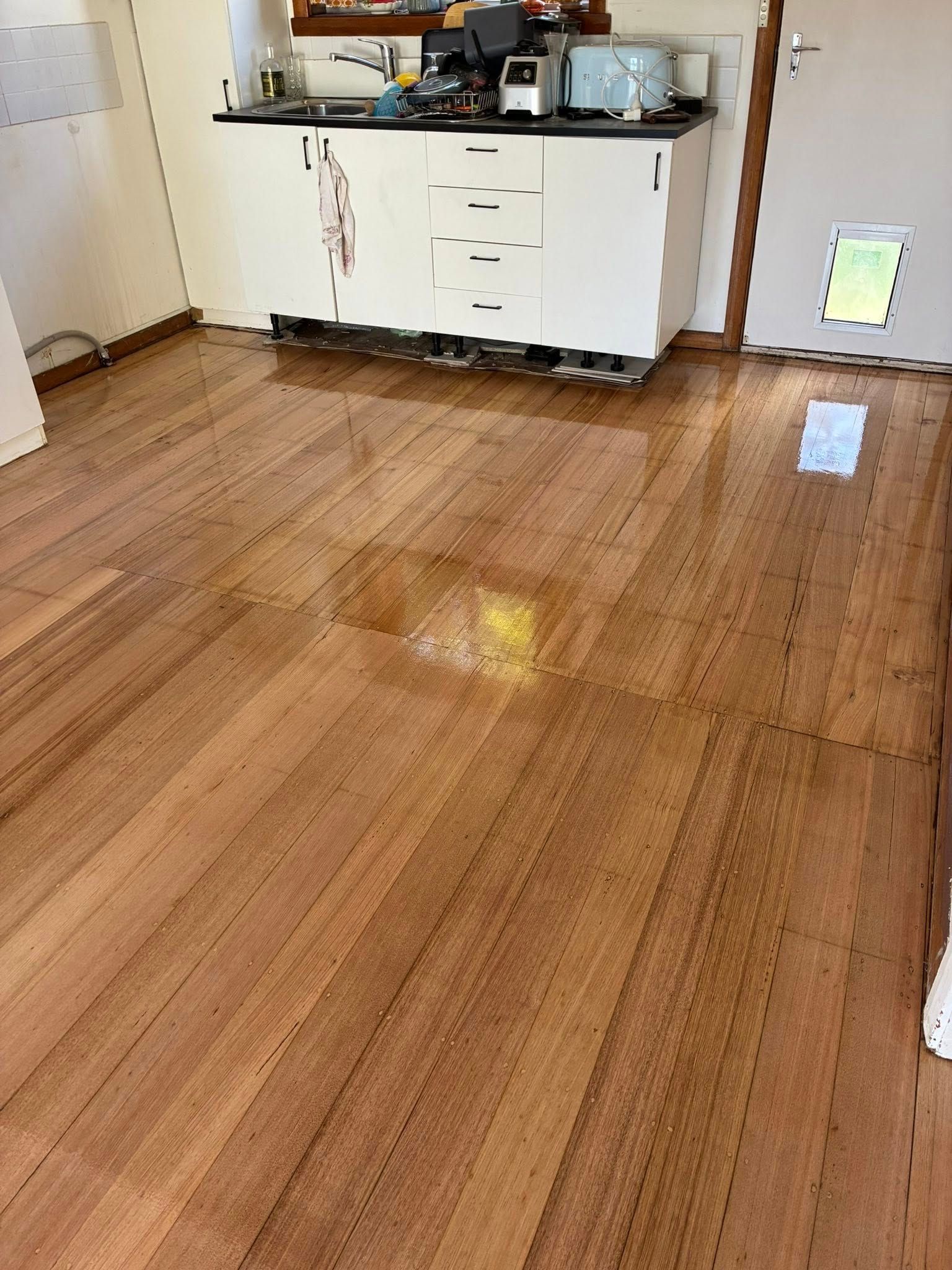 A Kitchen With Polished Light Brown Wood Flooring — Finer Floors In Warrane, TAS