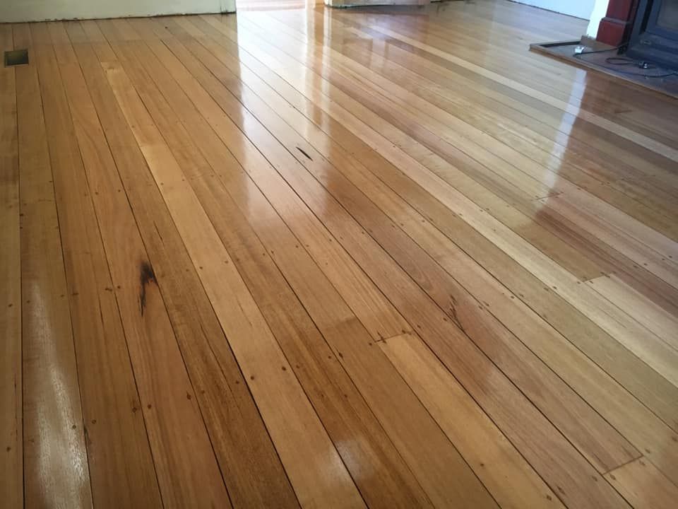 Polished Honey-coloured Hardwood Floorboards Running — Finer Floors In Warrane, TAS