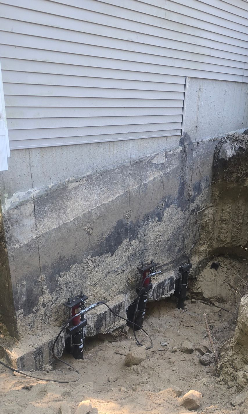 A yellow measuring tape rests against a porch step, indicating a height of approximately 7 inches.