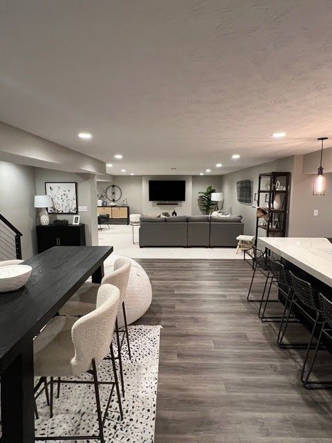 There is a table and chairs in the middle of the room. There is a table and chairs in the middle of the room.