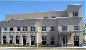 A large building with a lot of windows and a door.