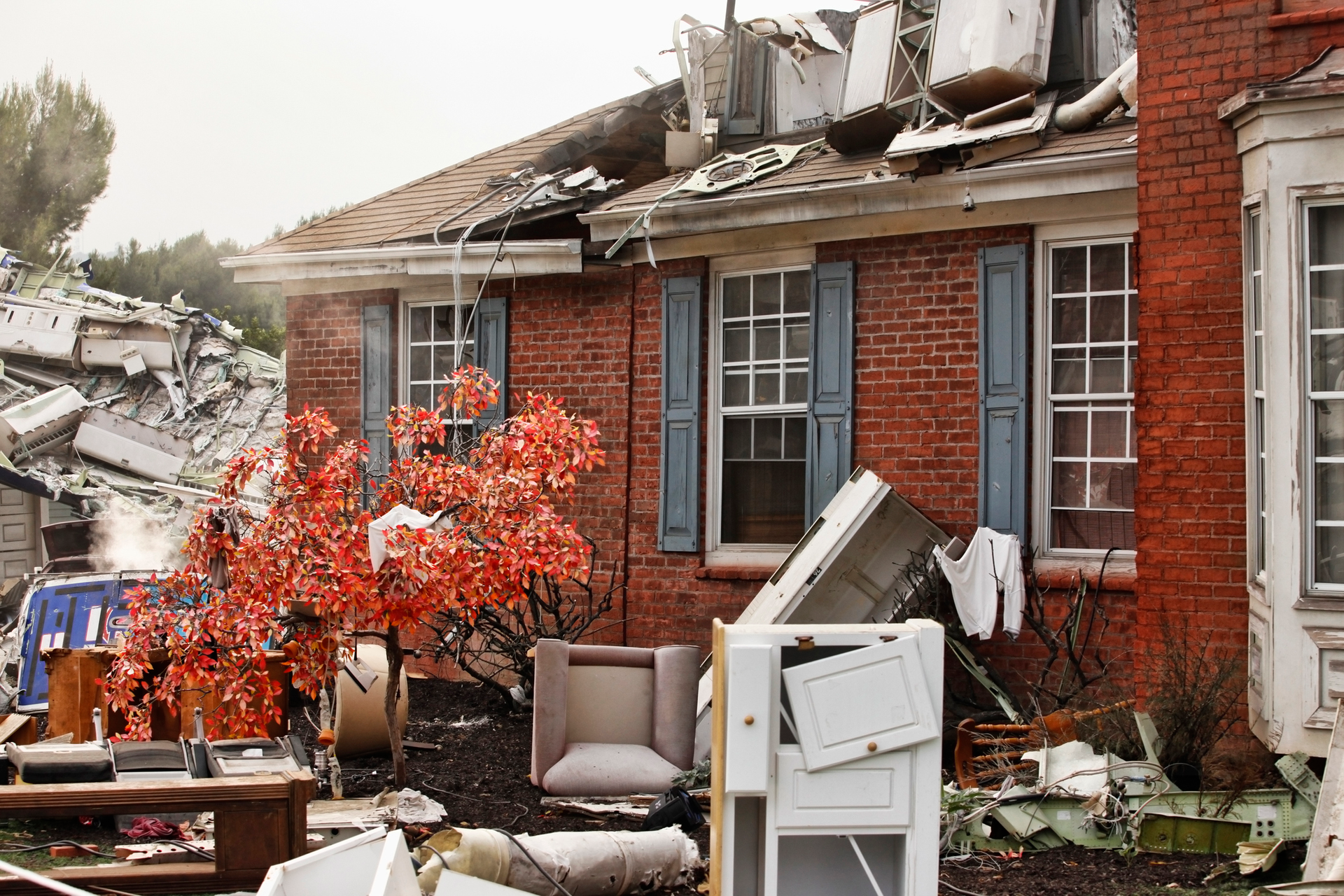 Red brick house, damaged by a natural disaster.