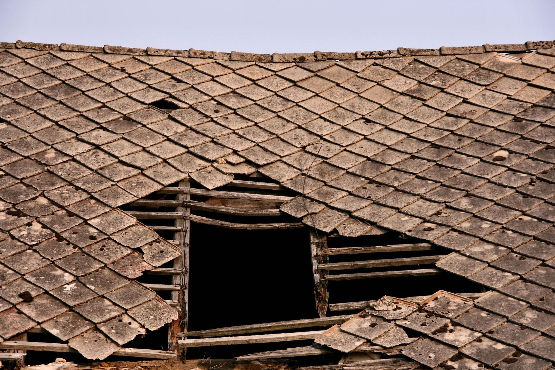 Damaged top floor needing urgent storm damage restoration after severe weather impact.