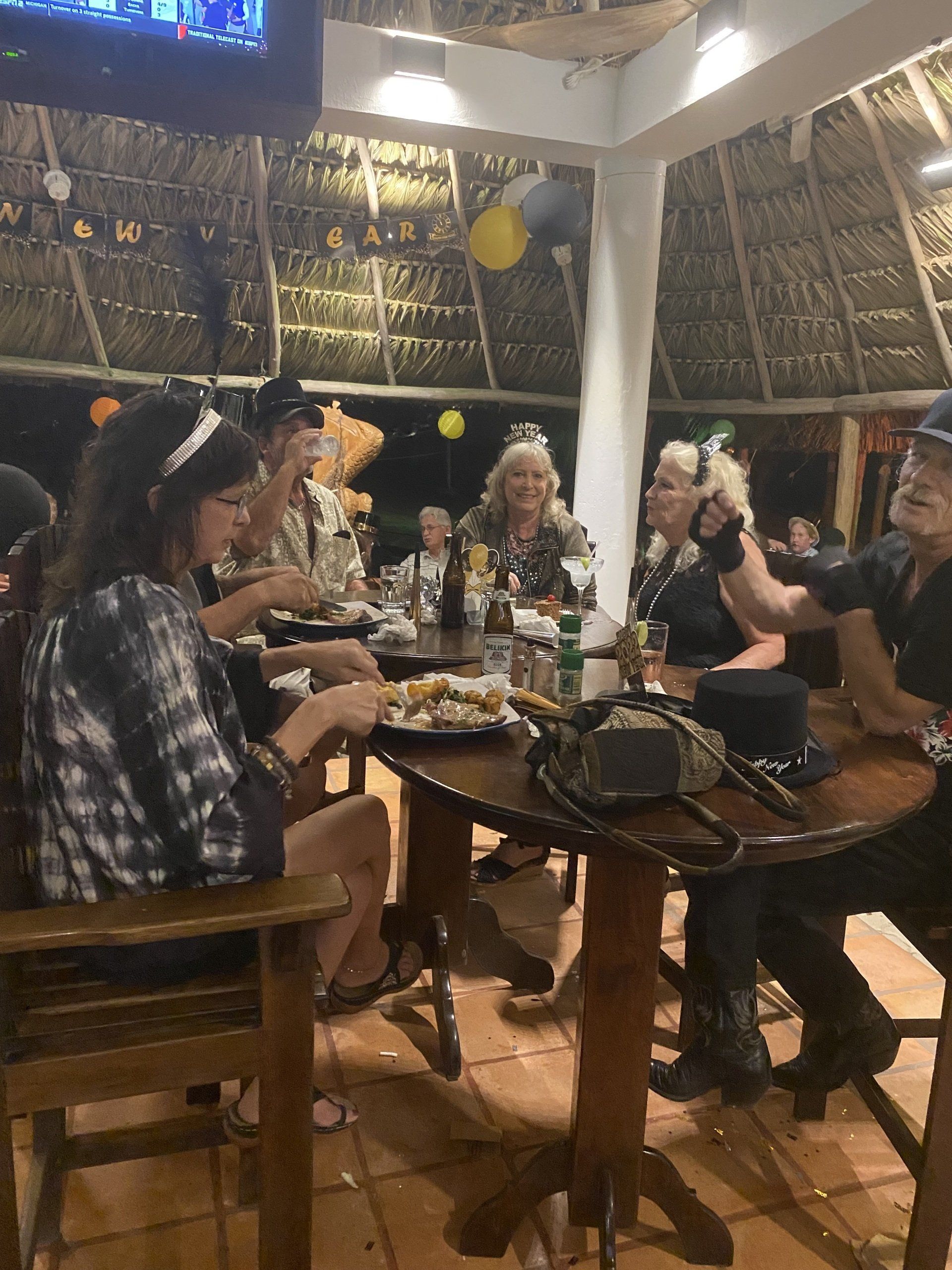 A group of people are sitting at a table eating food.