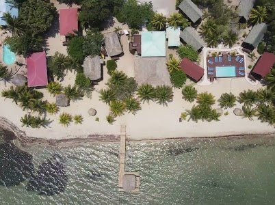 An aerial view of a beach resort with a swimming pool