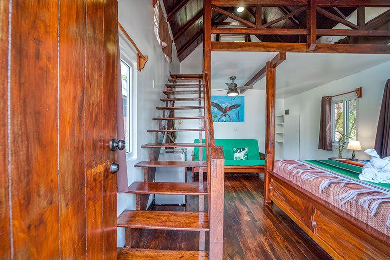 A wooden staircase leading up to the second floor of a house.
