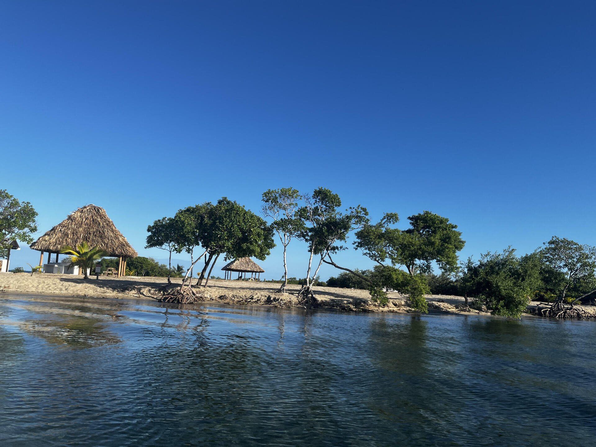 A small island in the middle of a body of water
