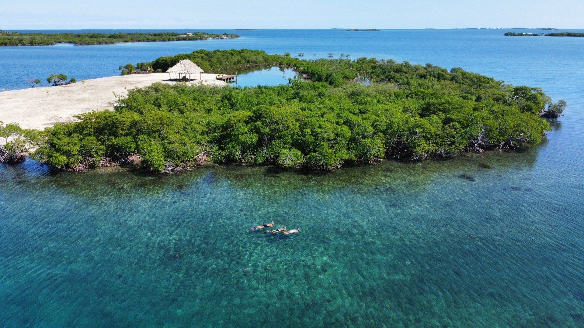 An aerial view of a small island in the middle of the ocean.