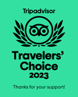 A green sign that says travelers choice 2023 thanks for your support.