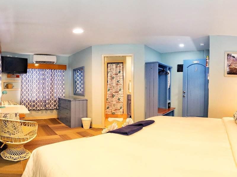 There is a large bed in the middle of the room.