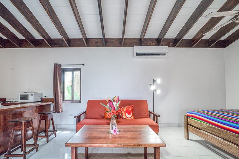 There is a couch and a table in the living room.